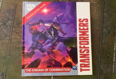 A copy of Transformers Enigma of Combination sitting on top of a gaming mat.
